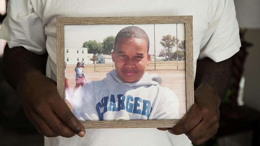 Image of a father holding son's photo frame