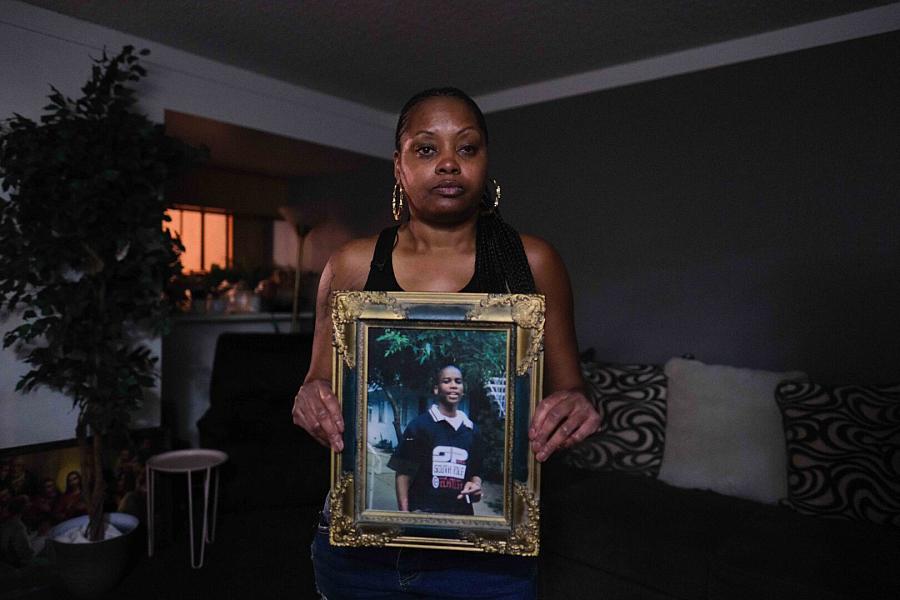 Image of woman with the portrait of her nephew