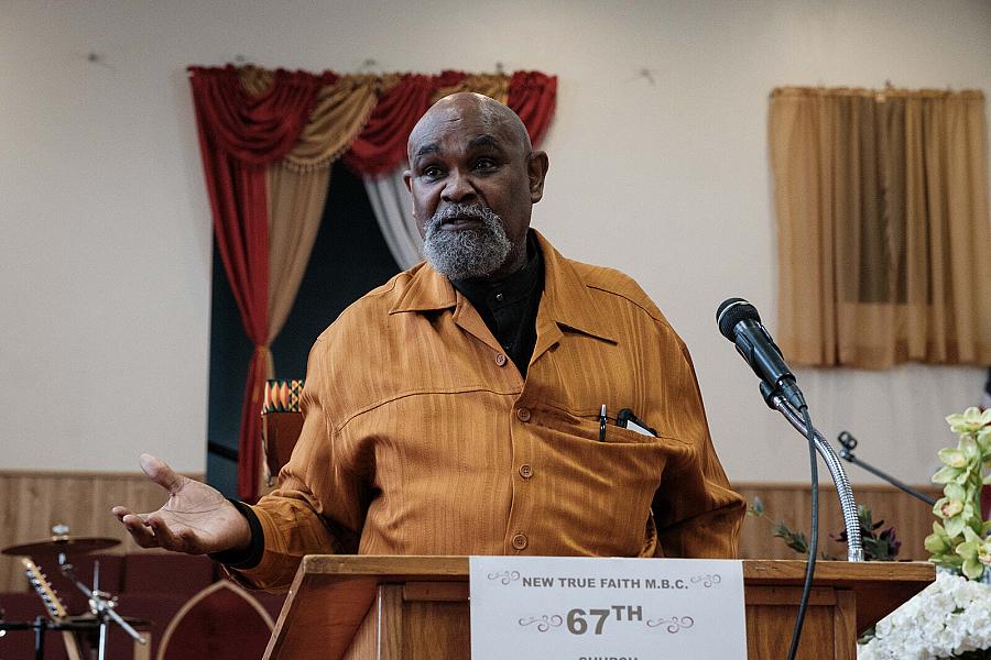 Image of a pastor speaking in the Baptist Church