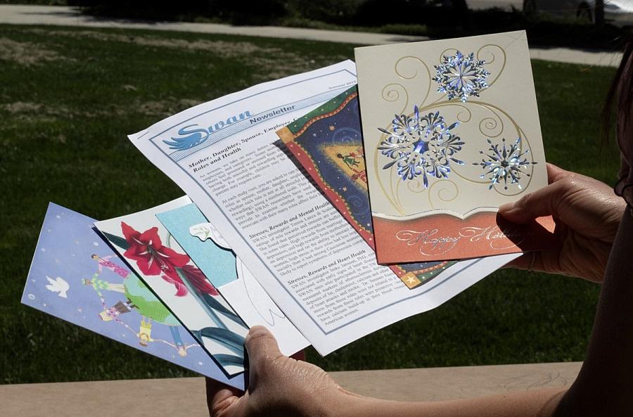 Person showing multiple documents