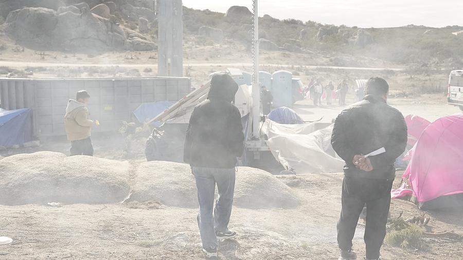 Image of people walking in dust