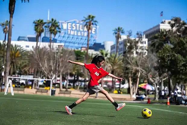 Image of a child playing soccer