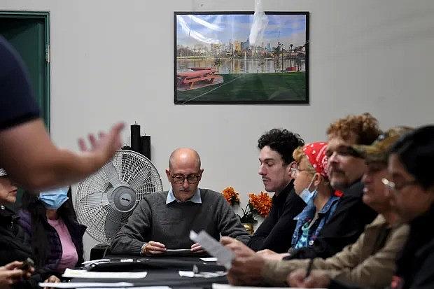 Image of people sitting across table