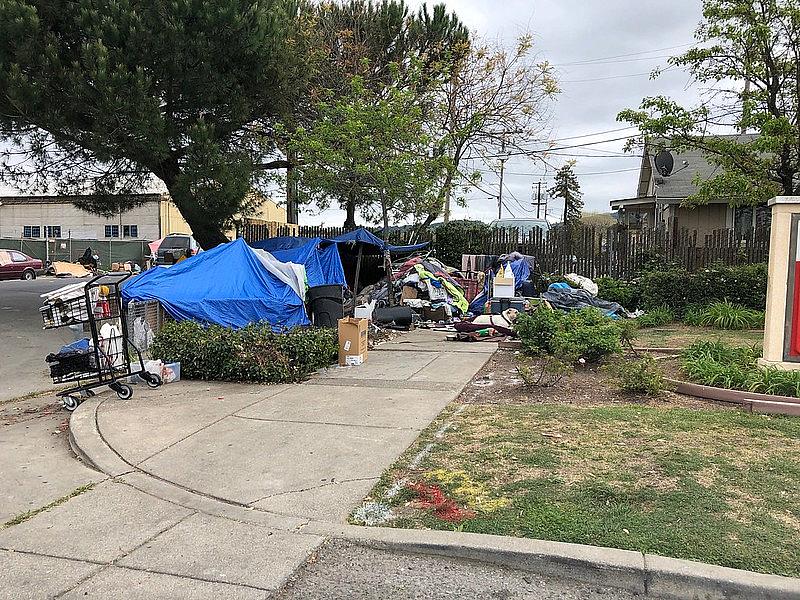 Image of huts on side of road