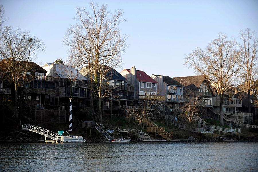 Homes sit on a levee designed to protect Augusta, Georgia, from the Savannah River. A push to open a birth center in Augusta has thus far failed, as officials have been unable to secure a patient transfer agreement with one of the city’s three local hospitals. (Rainier Ehrhardt/Associated Press)