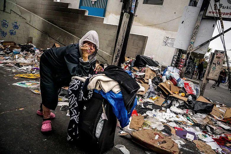 An image of a person with trash in background