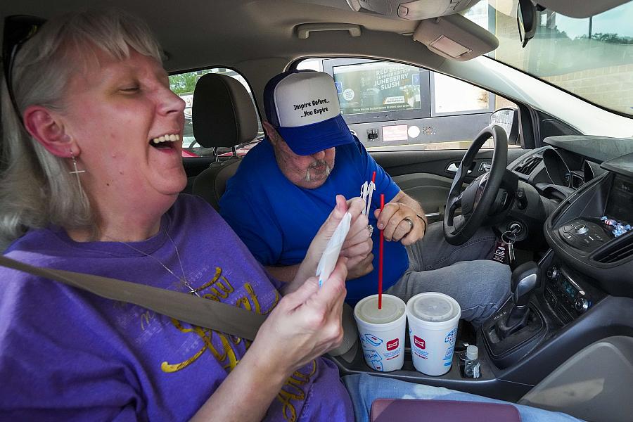 Image of two people in a car