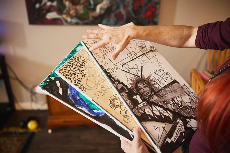 A person holding artwork