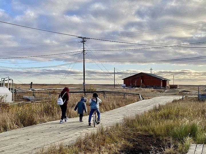 Image of a family walking home