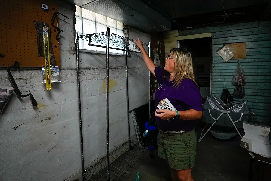 A person setting up testing equipment