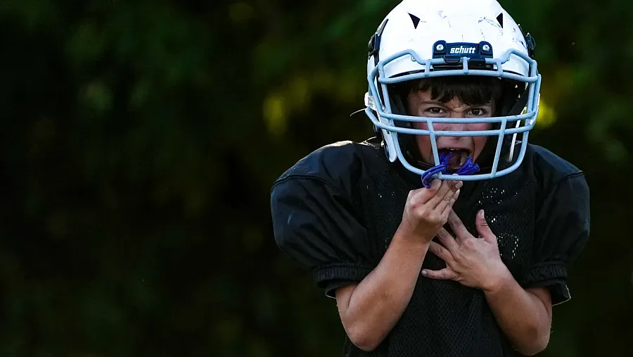 A person wearing a basketball helmet 