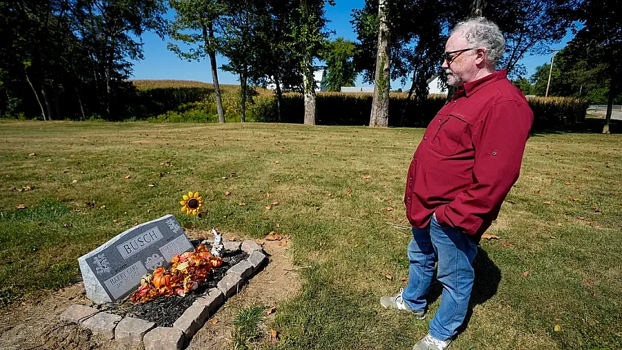 Buddy Busch stands at his wife Patricia's gravesite after she died from radon-induced lung cancer.