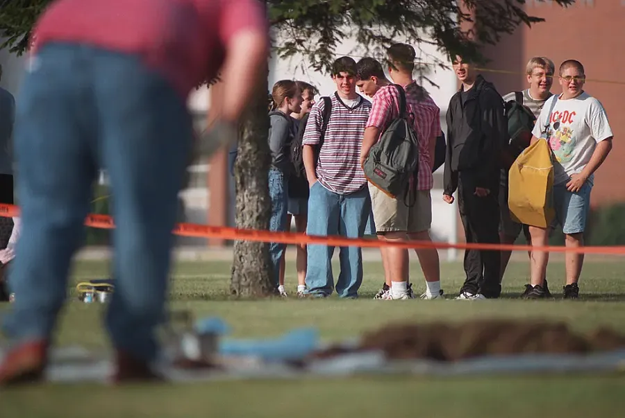 Student watch school yard being dug