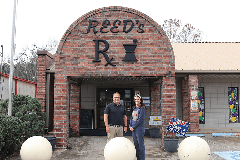 Rebecca Cormier and John Reed outside Reed’s Pharmacy