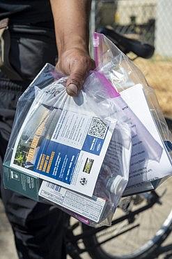 A person with plastic bag in hand