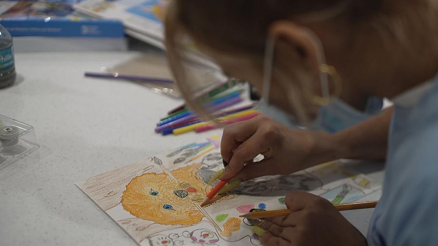 A child drawing on a piece of paper