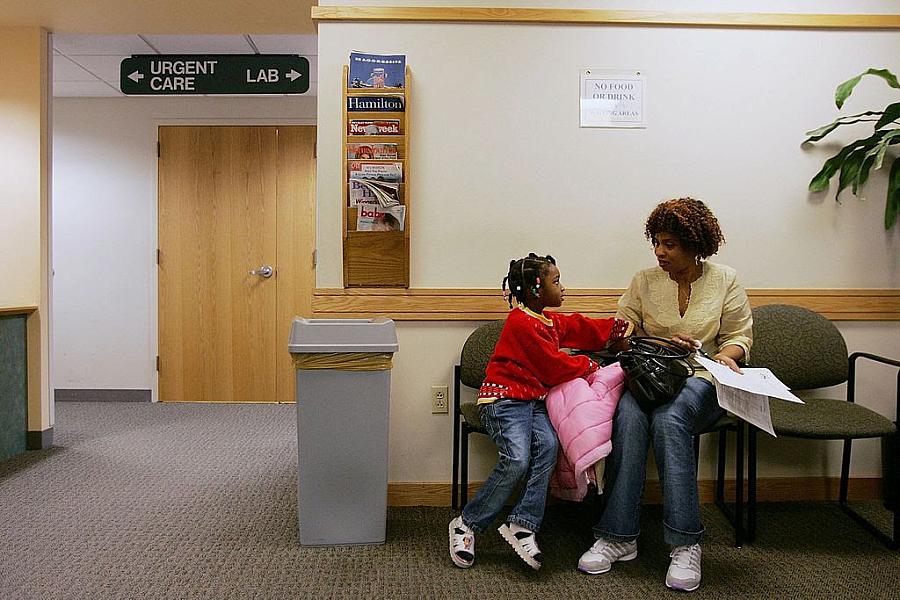 A person sitting with their child in the clinic's waiting area