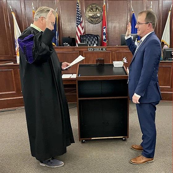 Image of a person swearing in court room