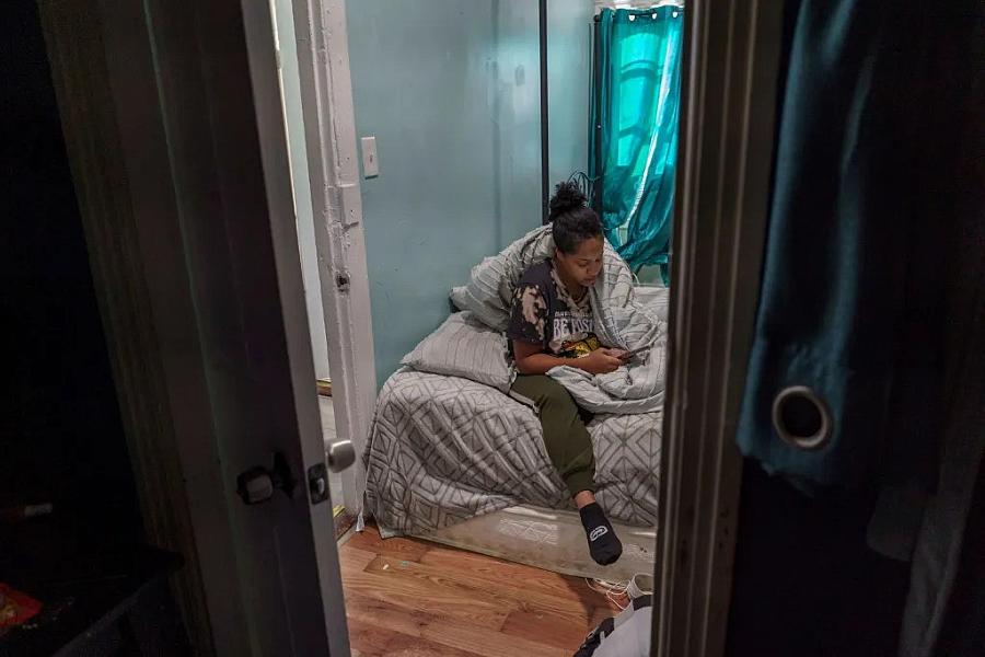 Image of a person sitting in a room