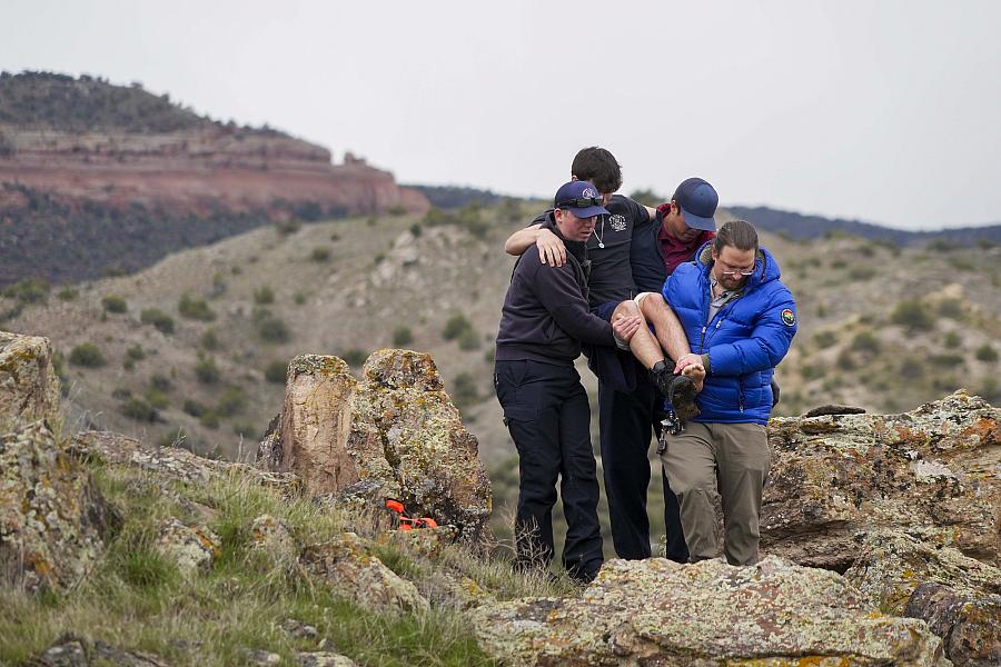 Image of people rescuing victim