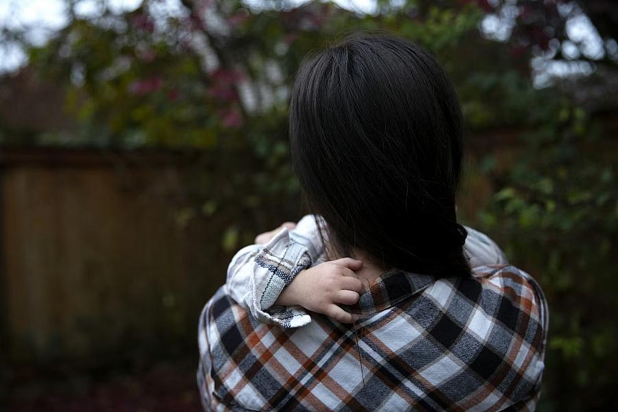 A person playing with a child