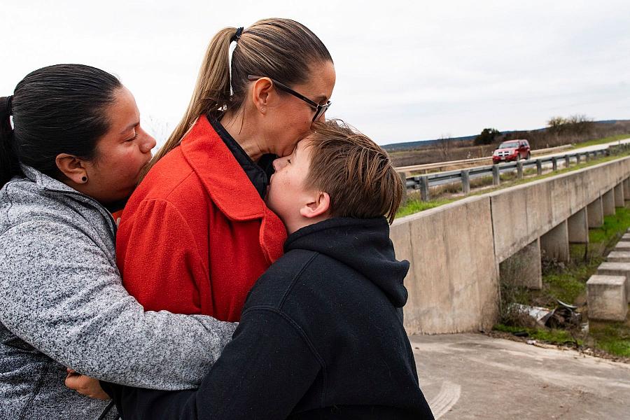 image of a family hugging