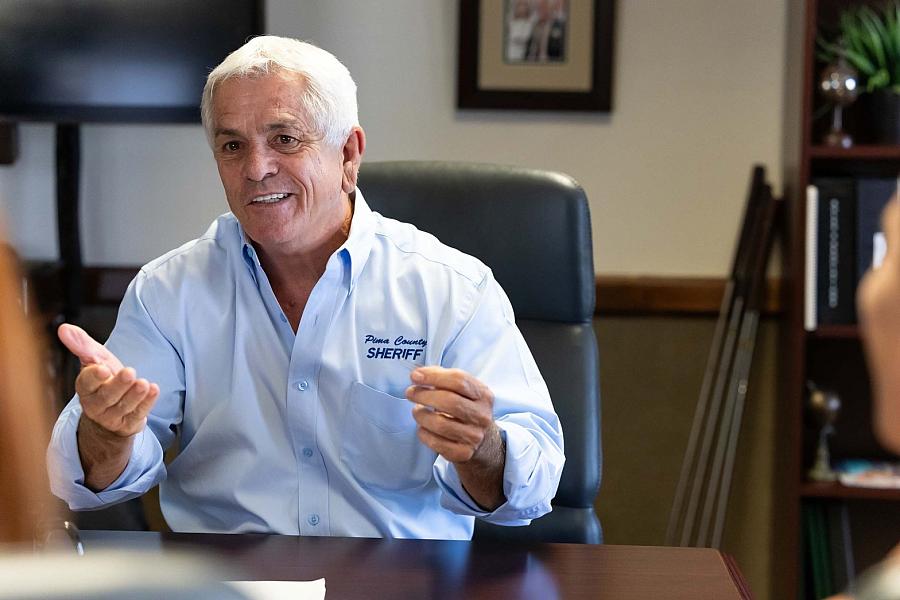 A person sitting on a chair with blue shirt