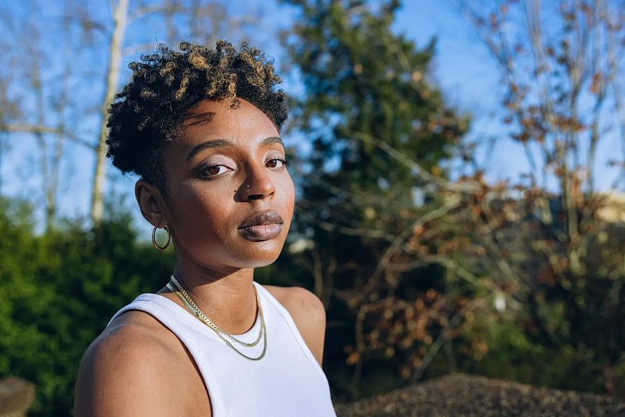 Shamari White, 26, poses for portraits at Meridian Hill/Malcolm X park in Washington, D.C., on March 5, 2023. (Maen Hammad/Word In Black)