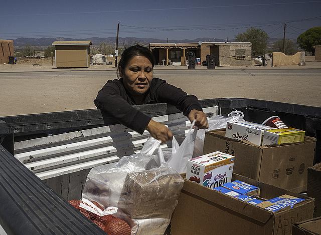 In New Mexico, Lynette Quintana loads up food from the USDA’s Food Distribution Program on Indian Reservations.