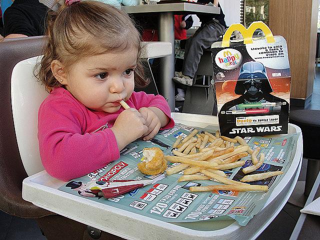 Casting an effort to pair toys with healthier meals rather than Happy Meals as a "ban" can bias the public against such policies.