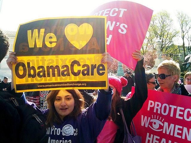 Women rally in favor of the ACA