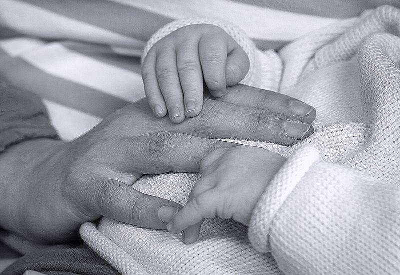 baby and adult hand