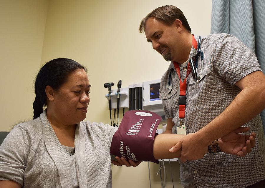 A patient at the Ravenswood Family Health Center in East Palo Alto has her blood pressure checked. In 2017, about 87 percent of 