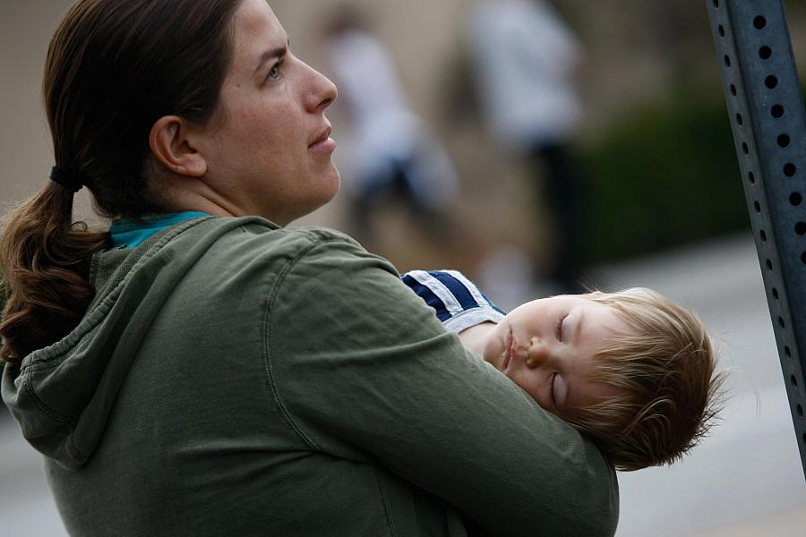 An uninsured mother and her son wait at a free health clinic in Inglewood, California.