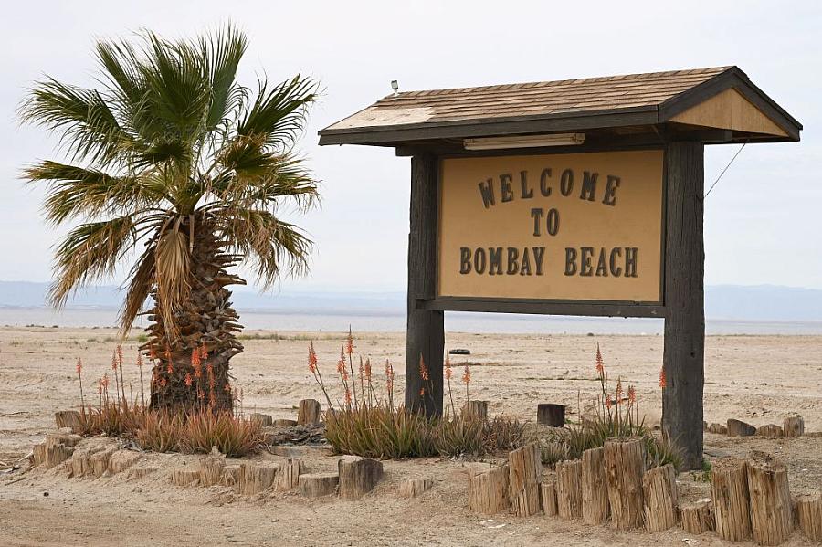 A sign advertises a once-thriving resort community along the shores of the Salton Sea.