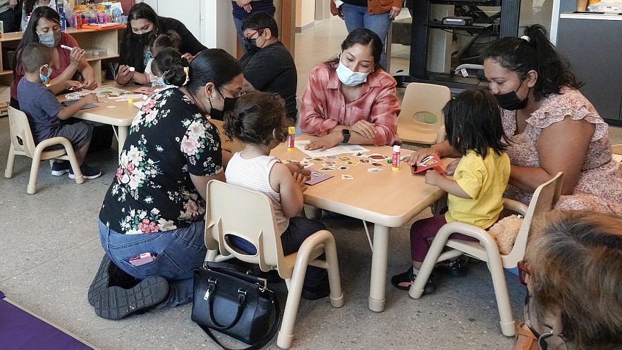 Parents and children take part in a toddler socialization gathering at the Children’s Institute. Parents and children take part in a toddler socialization gathering at the Children’s Institute.
