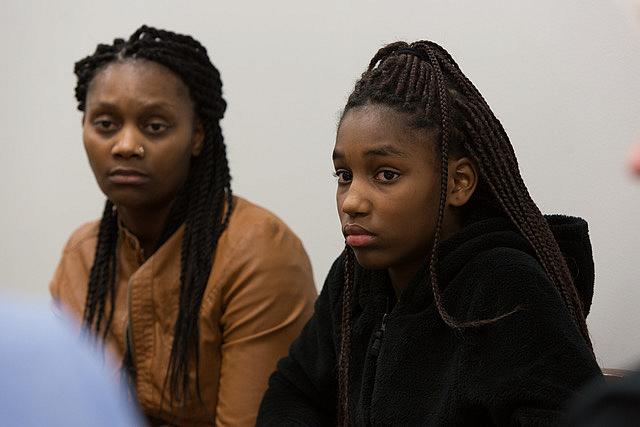 Connie White, left, and her daughter, Lataevia Gaskin, listen during a Restorative Justice Louisville meeting in January 2018. (