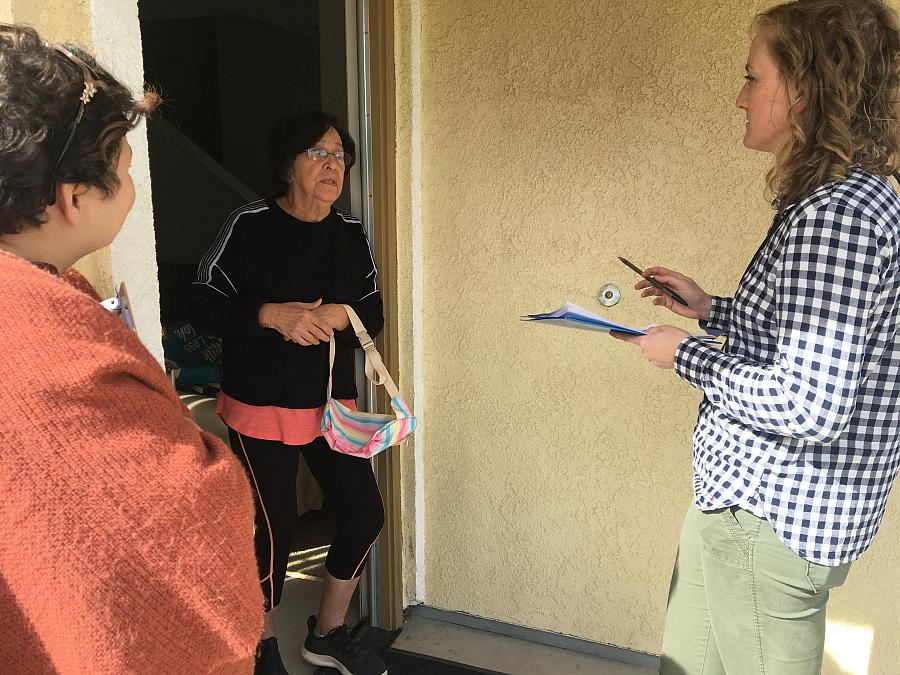 Lindsey Holden and Promotora Silvia Santini interview a tenant while canvassing around San Luis Obispo County.