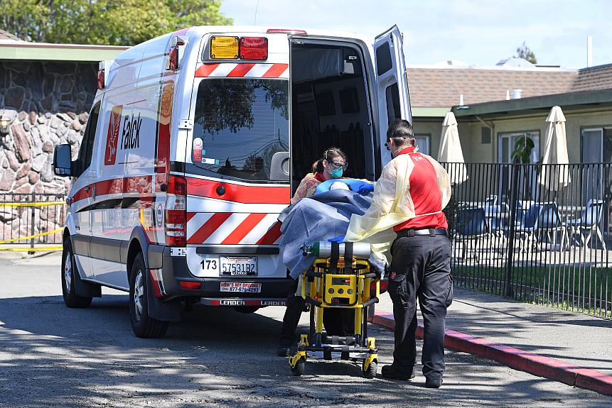 A senior is transferred into a nursing home in Hayward, California on April 10, 2020.