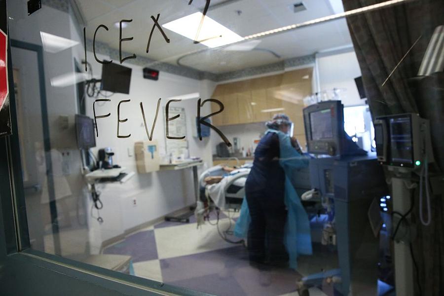 A nurse cares for a COVID-19 patient at El Centro Regional Medical Center in hard-hit Imperial County in July in El Centro, Cali