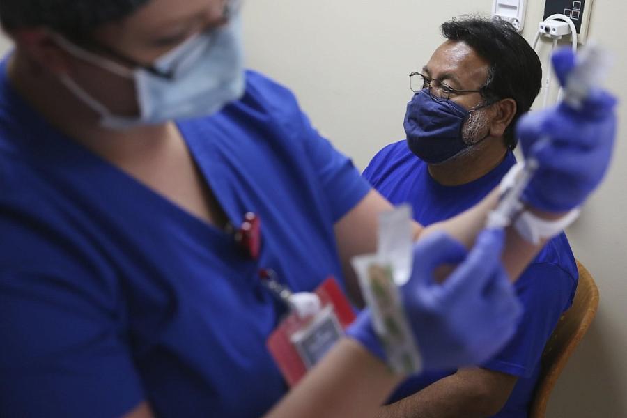  Albert Gutierrez waits for his COVID-19 vaccine at Texas Vista Medical Center in March 2021. 