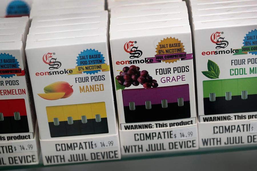 “Without flavors like mango or mint, I think most teens would lose interest in vaping and not continue after an initial try,” researcher Richard Miech said. Above, vaping products on sale in Chicago, Illinois. “Without flavors like mango or mint, I think most teens would lose interest in vaping and not continue after an initial try,” re