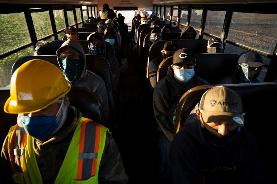 Farm laborers arrived for their shift in April in Greenfield, California. Farm laborers arrived for their shift in April in Greenfield, California.
