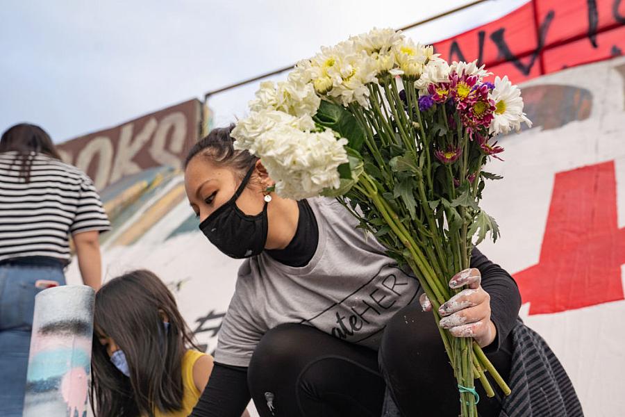 A group paints a mural denouncing anti-Asian hate in Atlanta, Georgia, after a shooting there left eight dead, including six wo