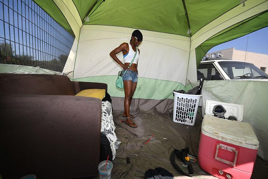 Zuri-Kinshasa Maria Terry, 46, stands in the tent she used to live in before being offered housing at the Tarzana Tiny Home in 2