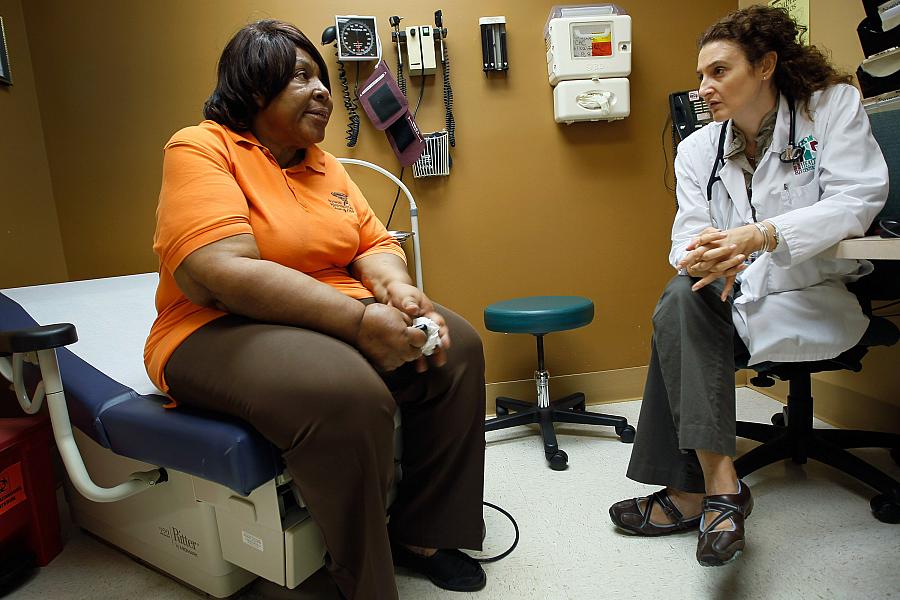 woman speaking with doctor