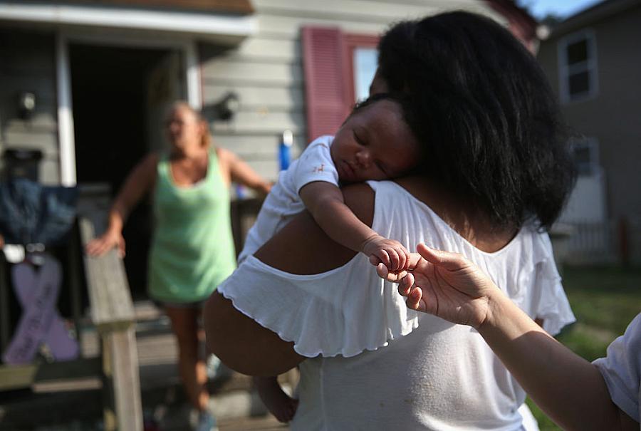 Grandmother Valencia Terrell arrives with her grandchild to stay temporarily at a friend's home on in Atlantic City. After her home was destroyed in Hurricane Sandy, she was forced to rely on food stamps and a local soup kitchen. Grandmother Valencia Terrell arrives with her grandchild to stay temporarily at a friend's home on in Atlantic City. After her h