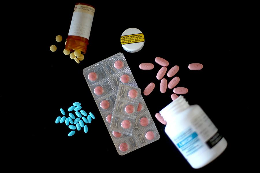 prescription pill bottles on a black background