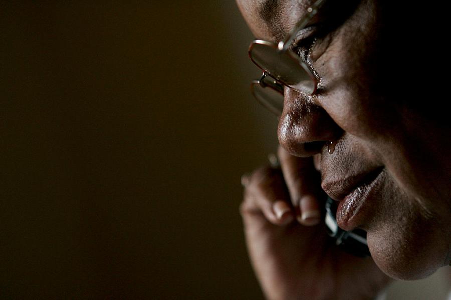 Kathy Curry of New Orleans cries as she learns that her daughter cannot make it for Thanksgiving and Christmas