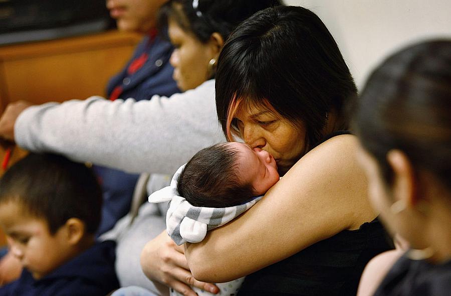 An uninsured mother and child at a community health center for low-income patients in Colorado.